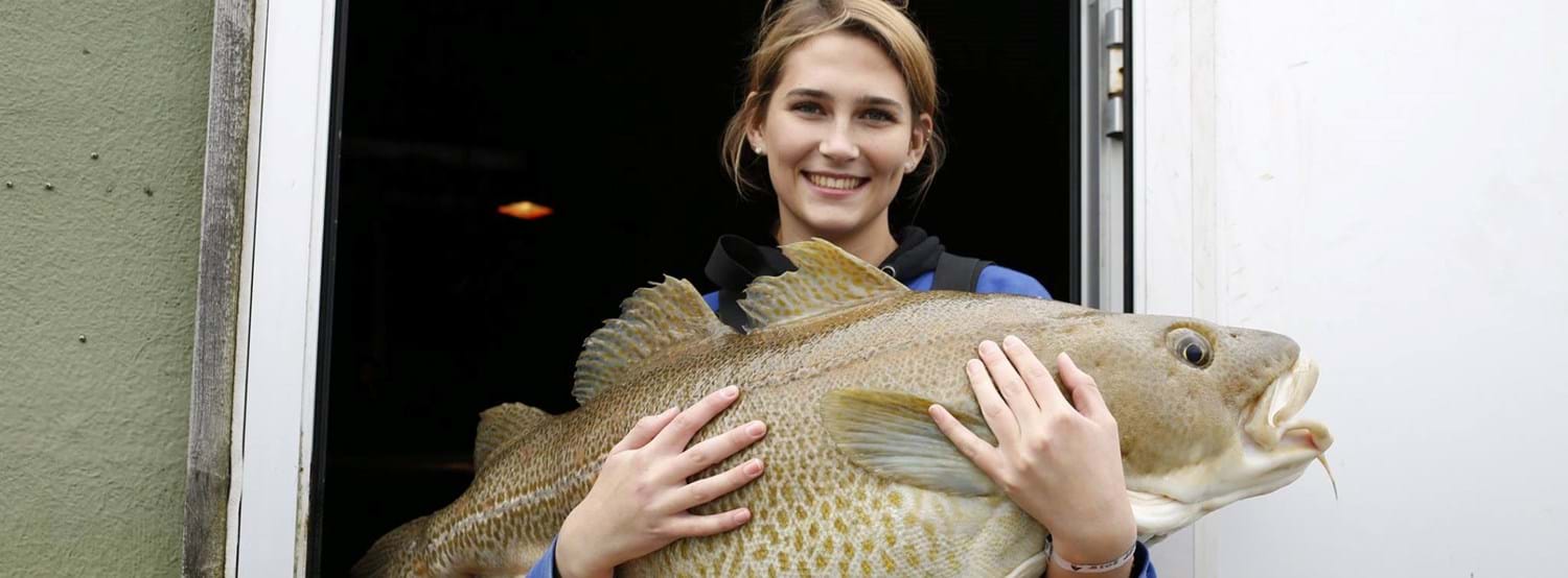Image of woman holding fish